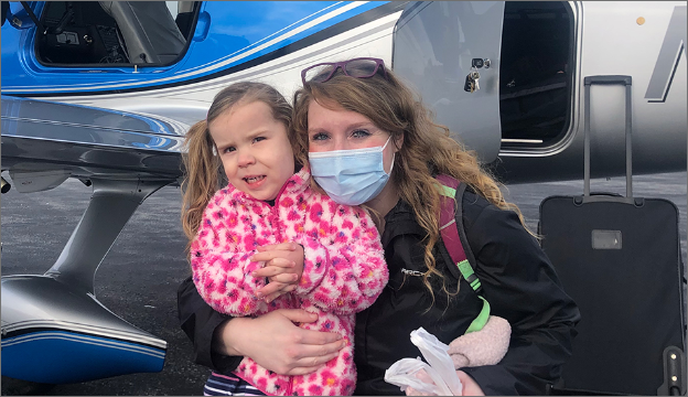 Quinlee and Mom preparing to board a free medical flight with PALS